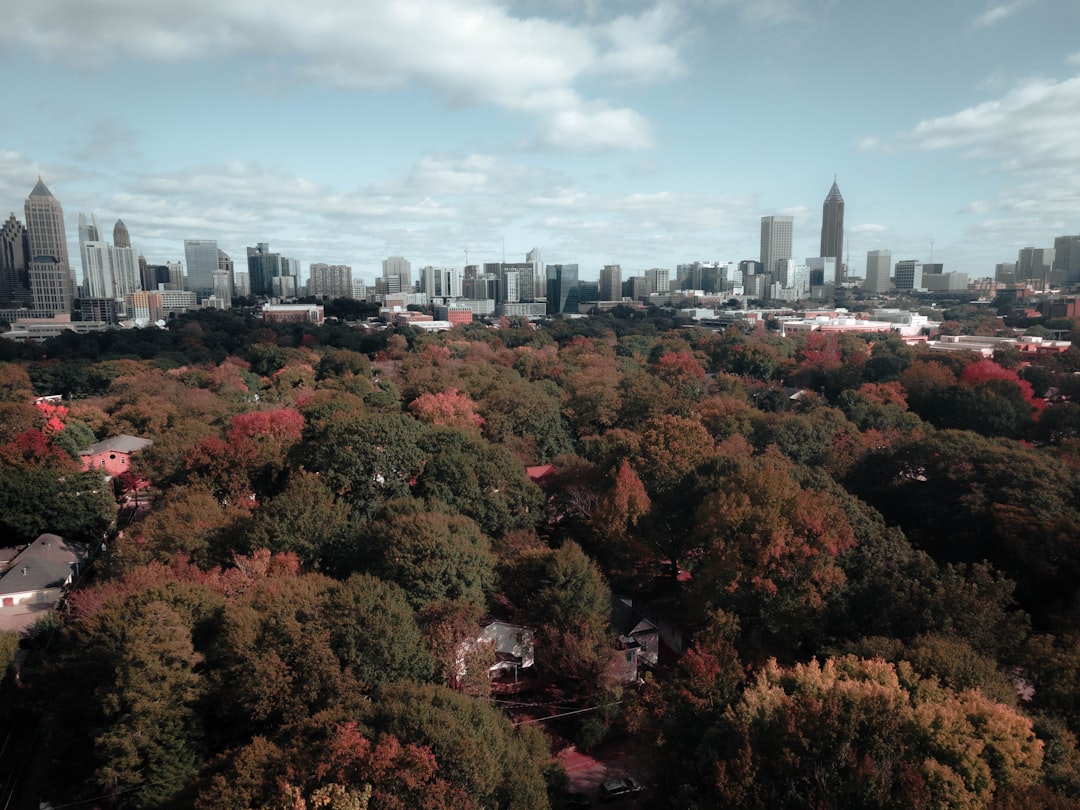 Dark storm clouds gather over the Atlanta skyline ahead of potential weather shifts from a developing El Niño pattern.