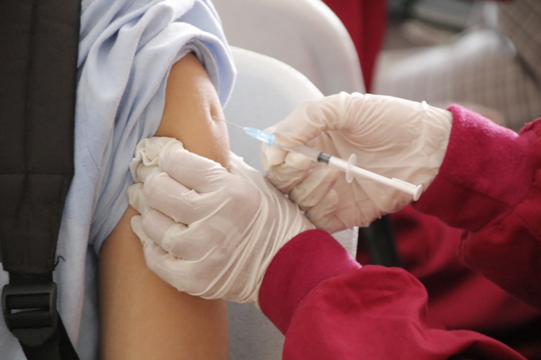 A public health worker prepares a measles vaccine during an outbreak at an Atlanta daycare.