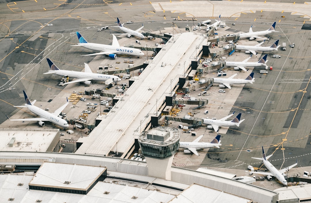 Grounded Delta airplanes parked densely on the tarmac at Hartsfield-Jackson Atlanta International Airport amid mass cancellations.