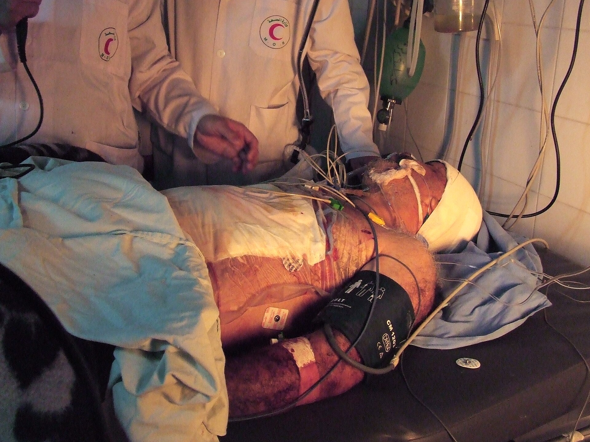 A Palestinian pediatrician in a medical coat inside a Gaza hospital ward, illustrating a story about detained medical workers