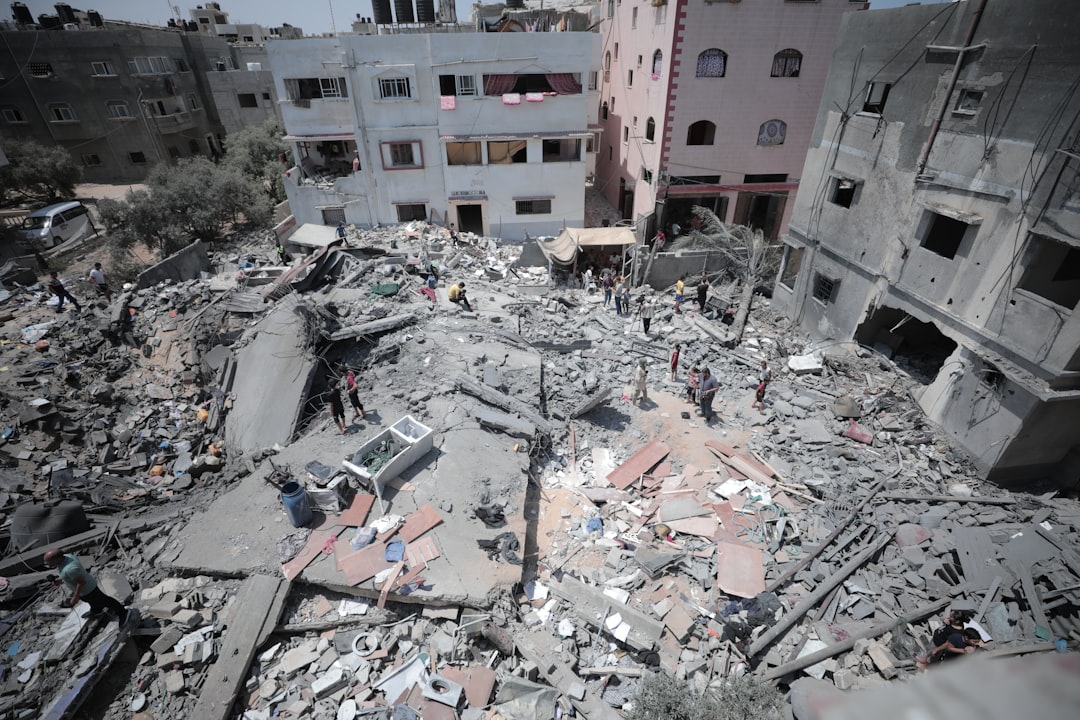 Palestinian children stand amid the rubble of destroyed buildings in Gaza