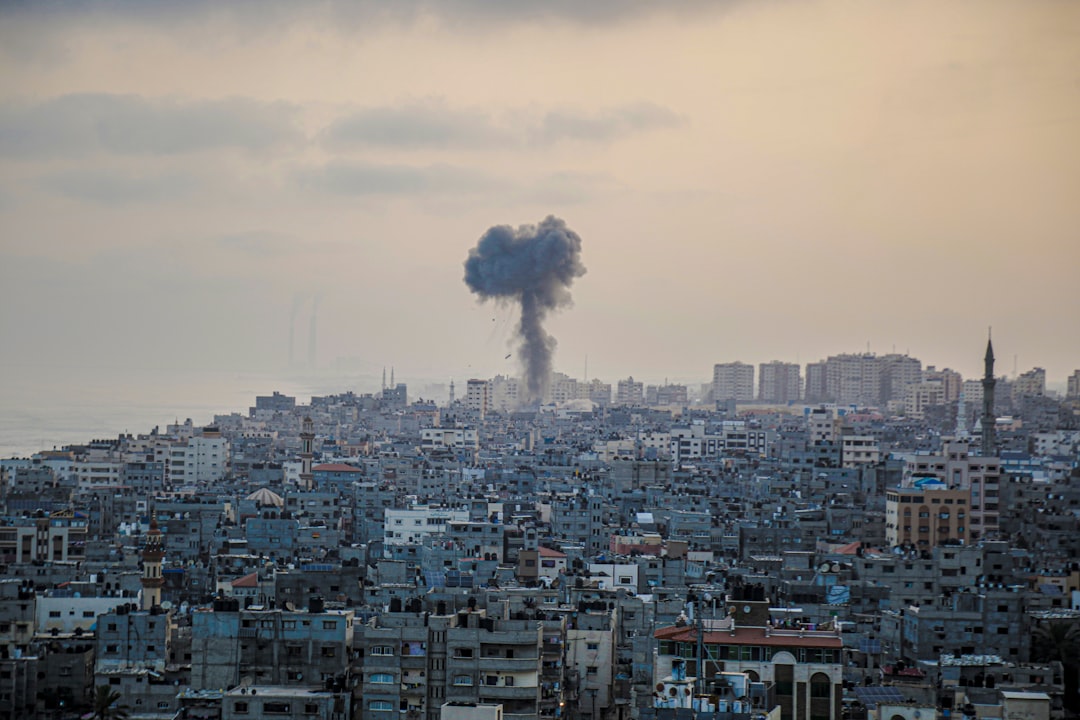 Palestinians searching through the rubble of a building destroyed by an Israeli airstrike in Gaza