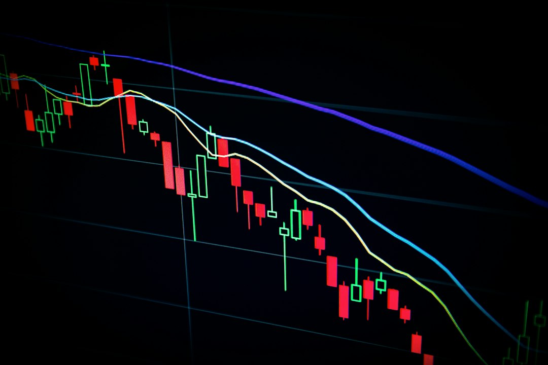 A semiconductor chip on a circuit board overlaid with a declining stock market chart, representing Wall Street's skeptical response to Nvidia's AI chip strategy and its effects on Atlanta's tech economy.