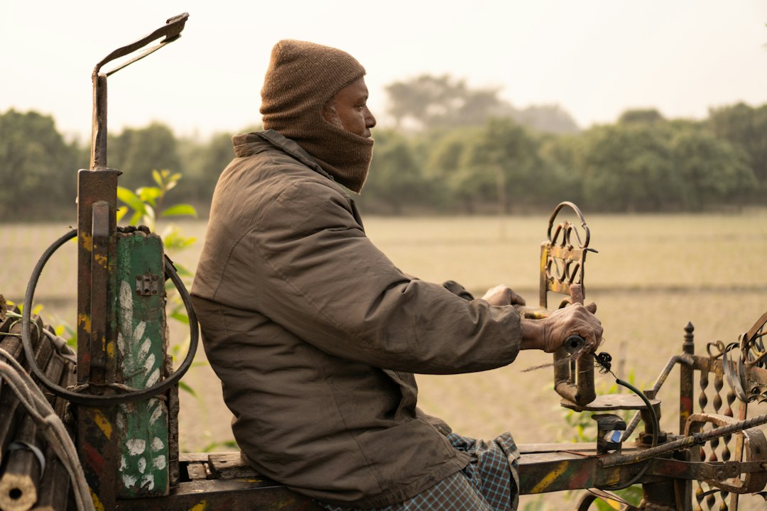 A farmer fueling a tractor at a diesel pump on a Georgia farm