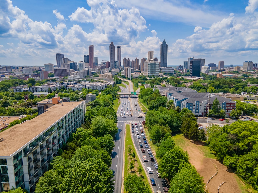 Aerial view of an Atlanta neighborhood showing modest homes and apartment buildings, illustrating economic disparity between renters and property owners