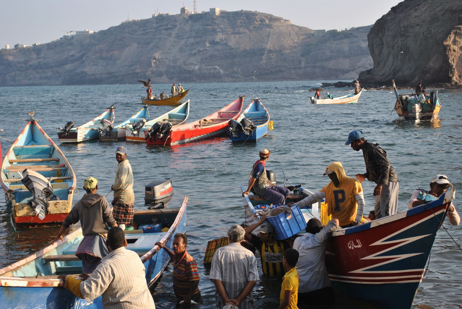 Yemeni civilians packed into a boat fleeing across the sea amid Saudi-Houthi strikes