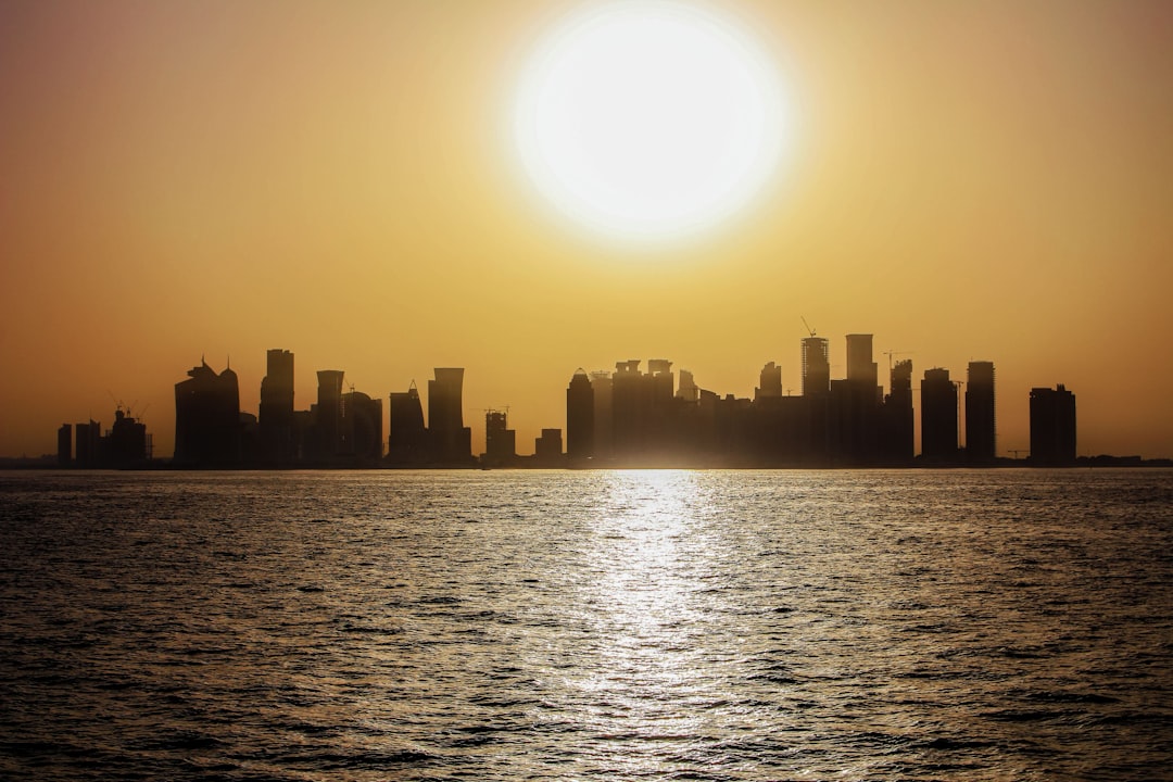 City skyline under an intense summer heat wave with the sun glaring over buildings