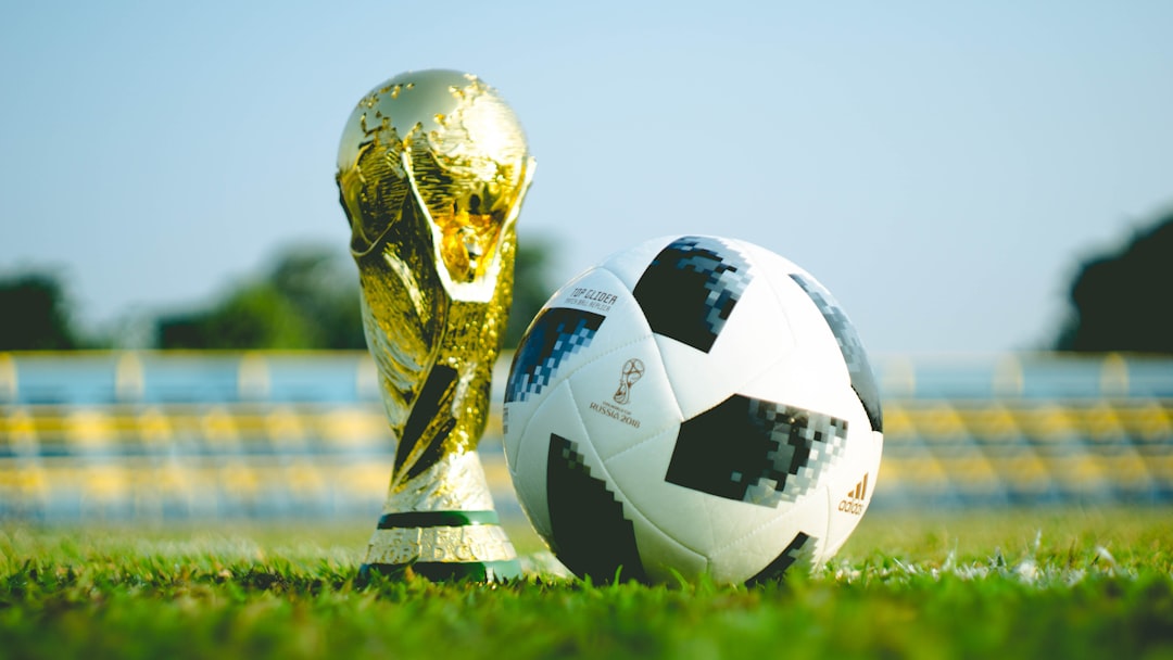 Soccer players competing during an international World Cup match on the pitch